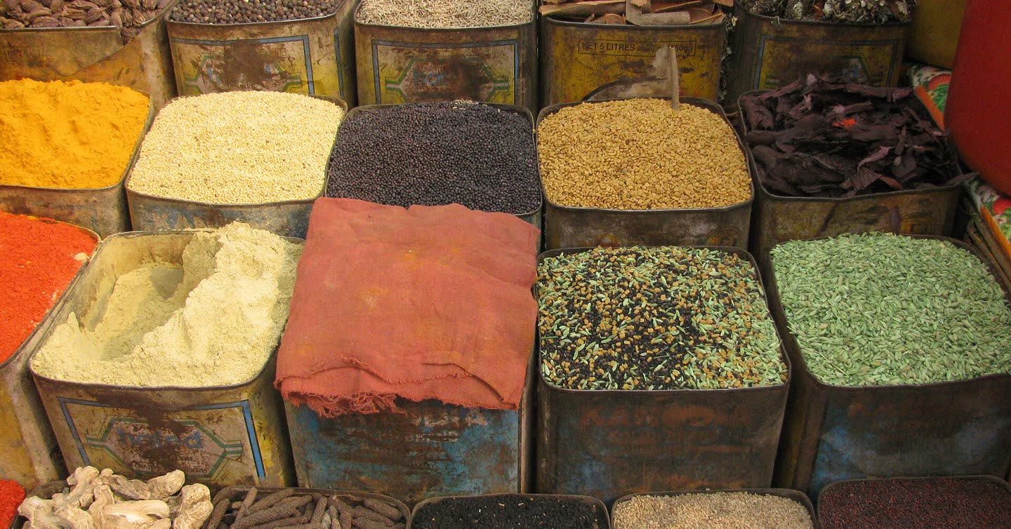 Open tins of whole and ground spices